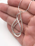 Textured and Polished Silver Wire Pendant