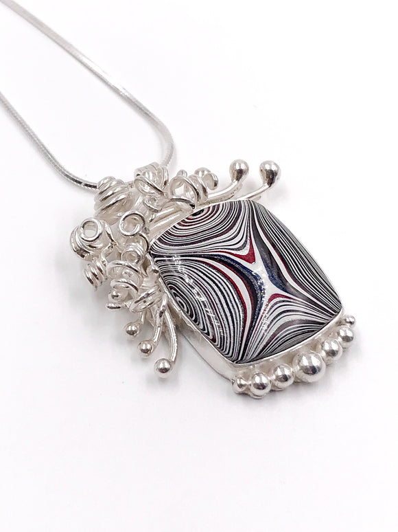 Fordite and Silver Pendant