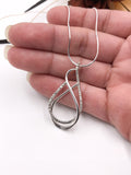 Textured and Polished Silver Wire Pendant