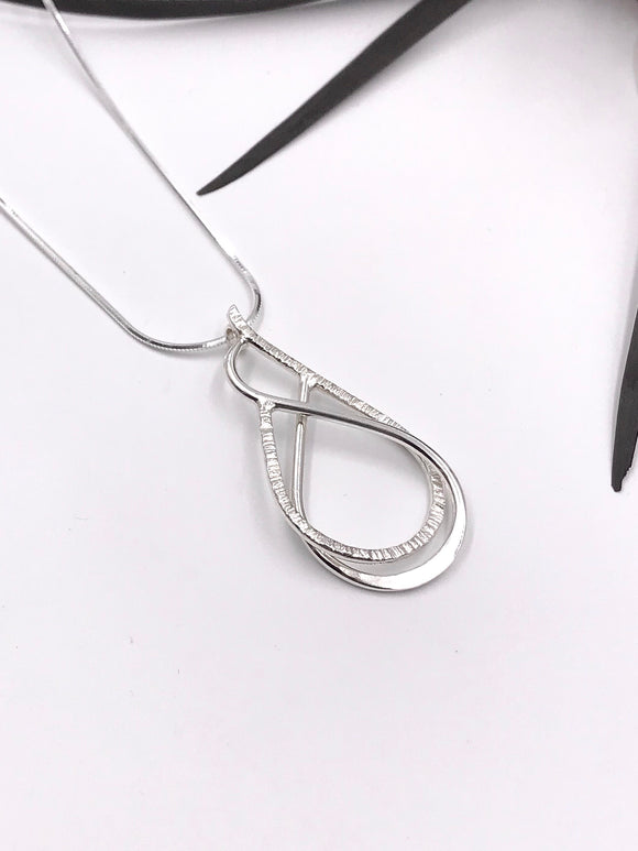 Textured and Polished Silver Wire Pendant