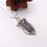 Fordite and Silver Pendant