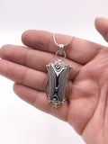 Fordite and Silver Pendant