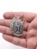 Fordite and Silver Pendant